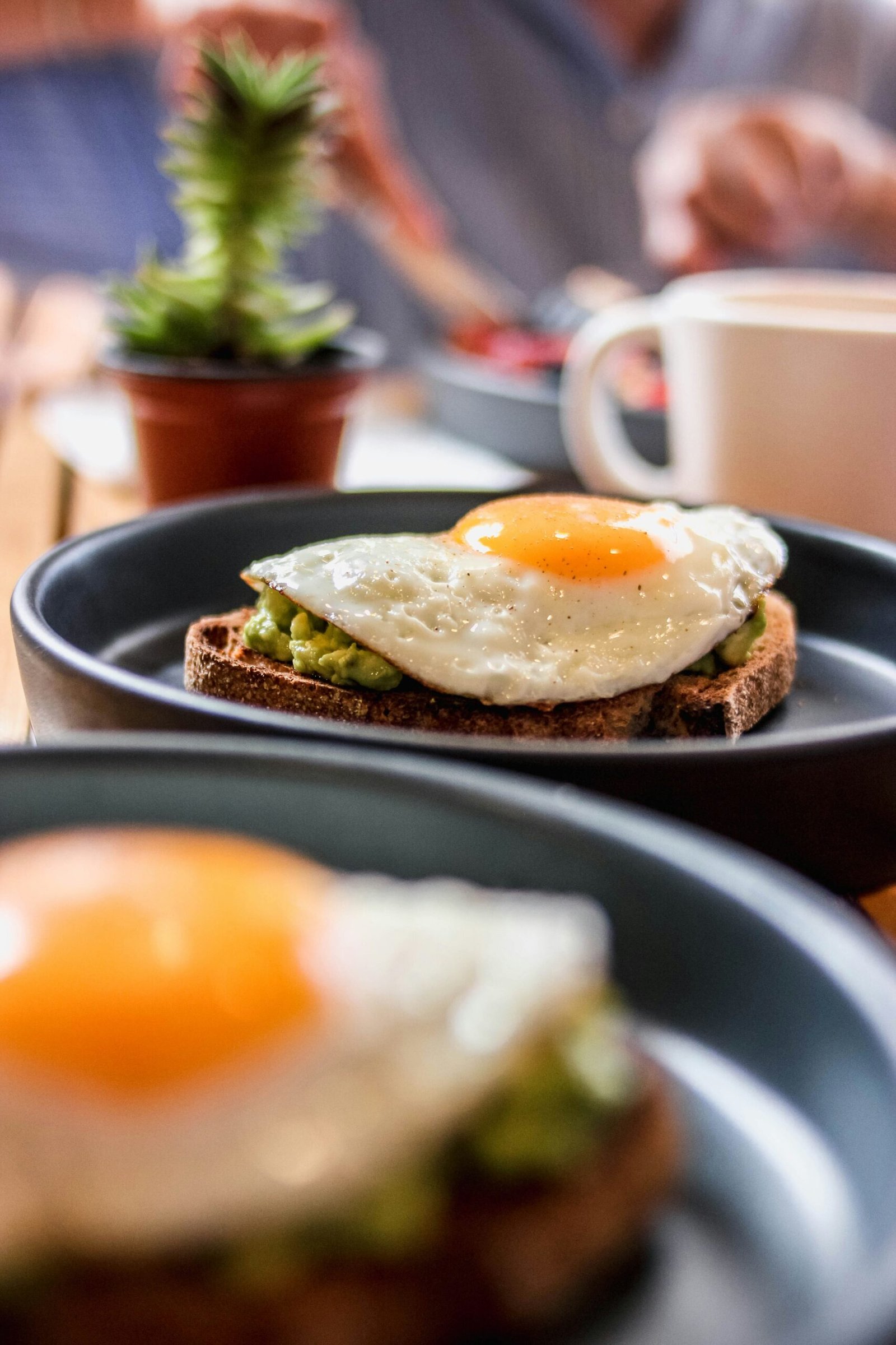 a plate of food with an egg on top of it